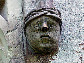 Head on the west side of the nave north window August 2007
